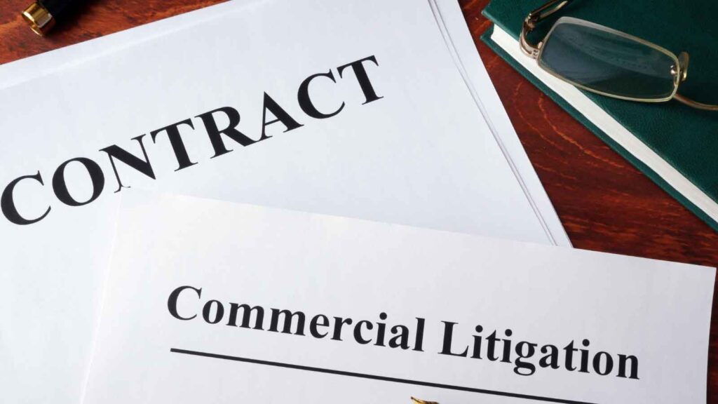 Contract and commercial litigation documents on a desk