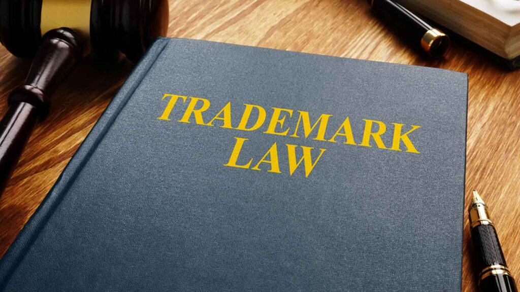 Close-up of a trademark law book and a judge’s gavel.