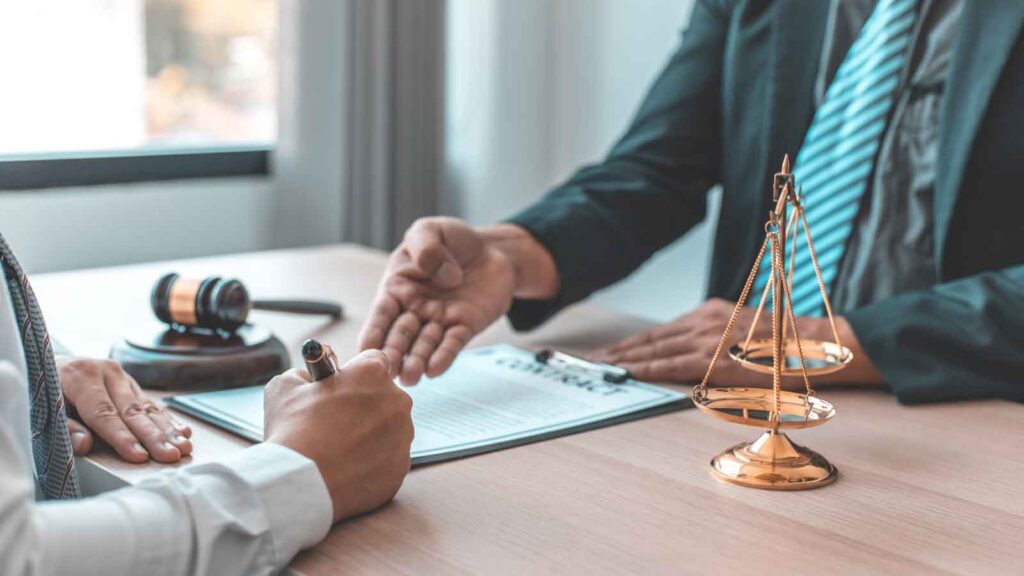Lawyer explaining legal documents to a client.