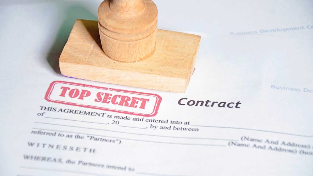 Stamped _Top Secret_ contract with wooden seal on paper