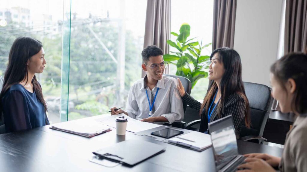 A group of colleagues having a meeting in a modern office.